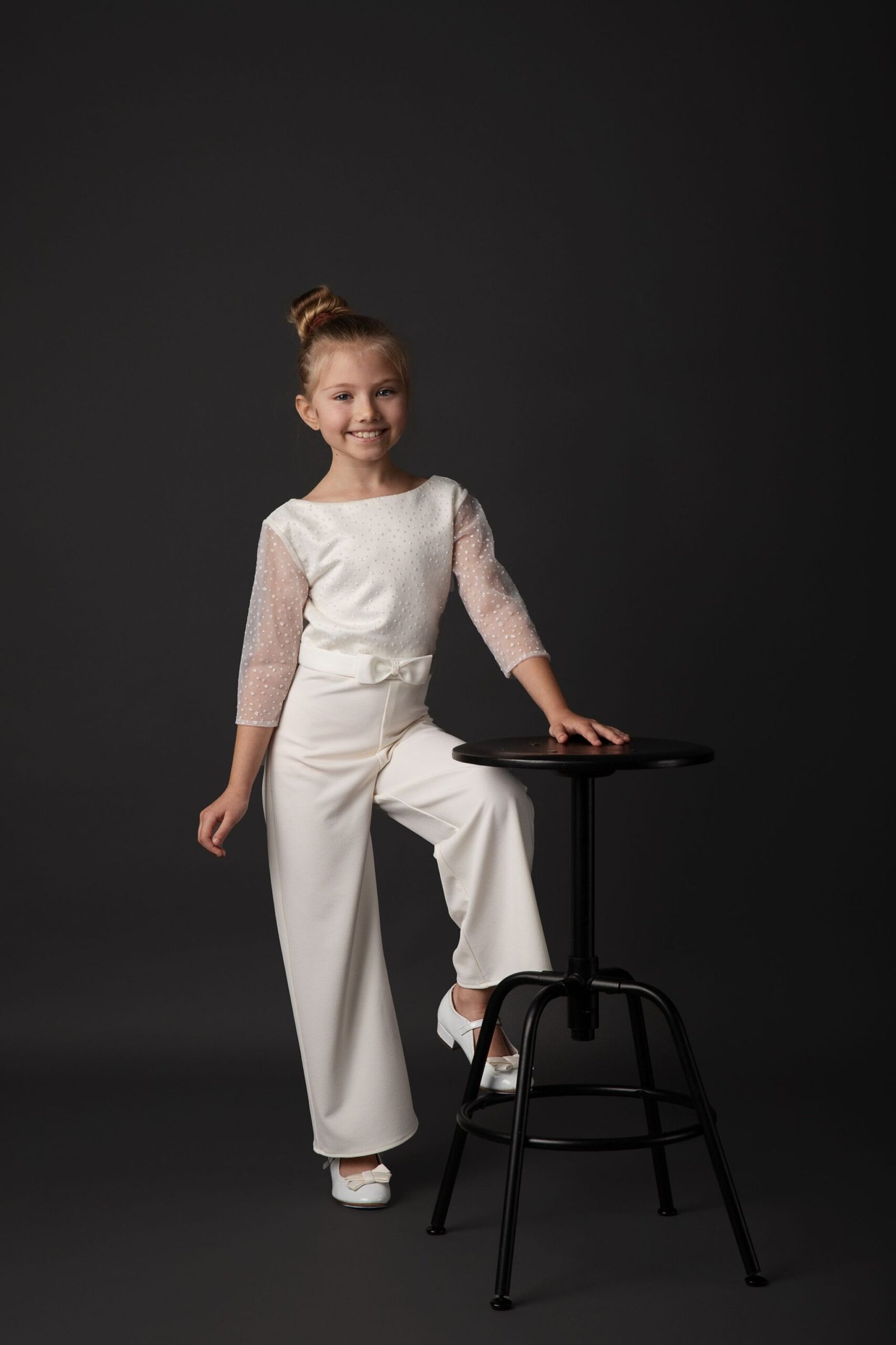 Communion-jumpsuit-Valeria-left-leg-up-Giga-Fashion-Dublin-12